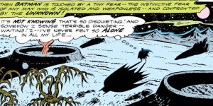 Batman wanders an alien landscape.