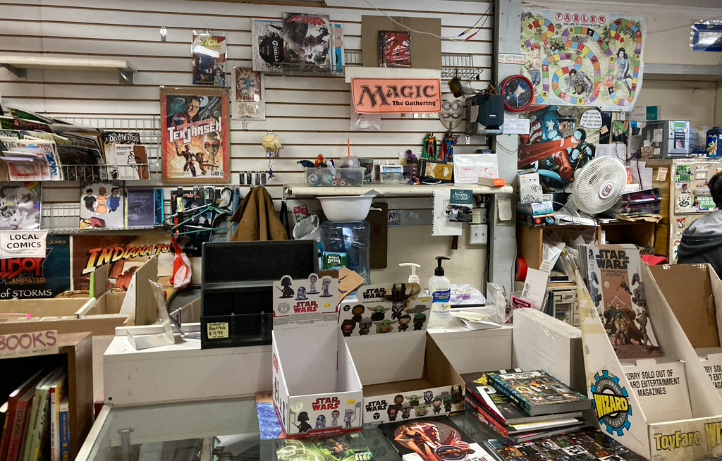Inside New England Comics of Harvard Square on its last day.